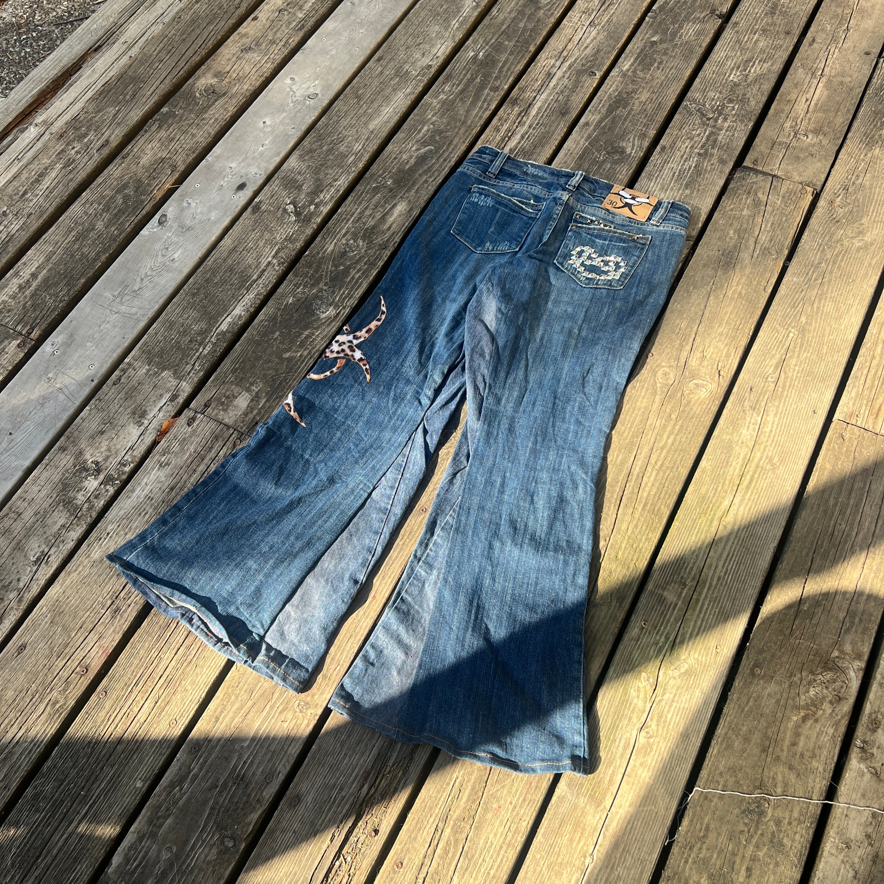 biohazard leopard/brass knuckle jeans