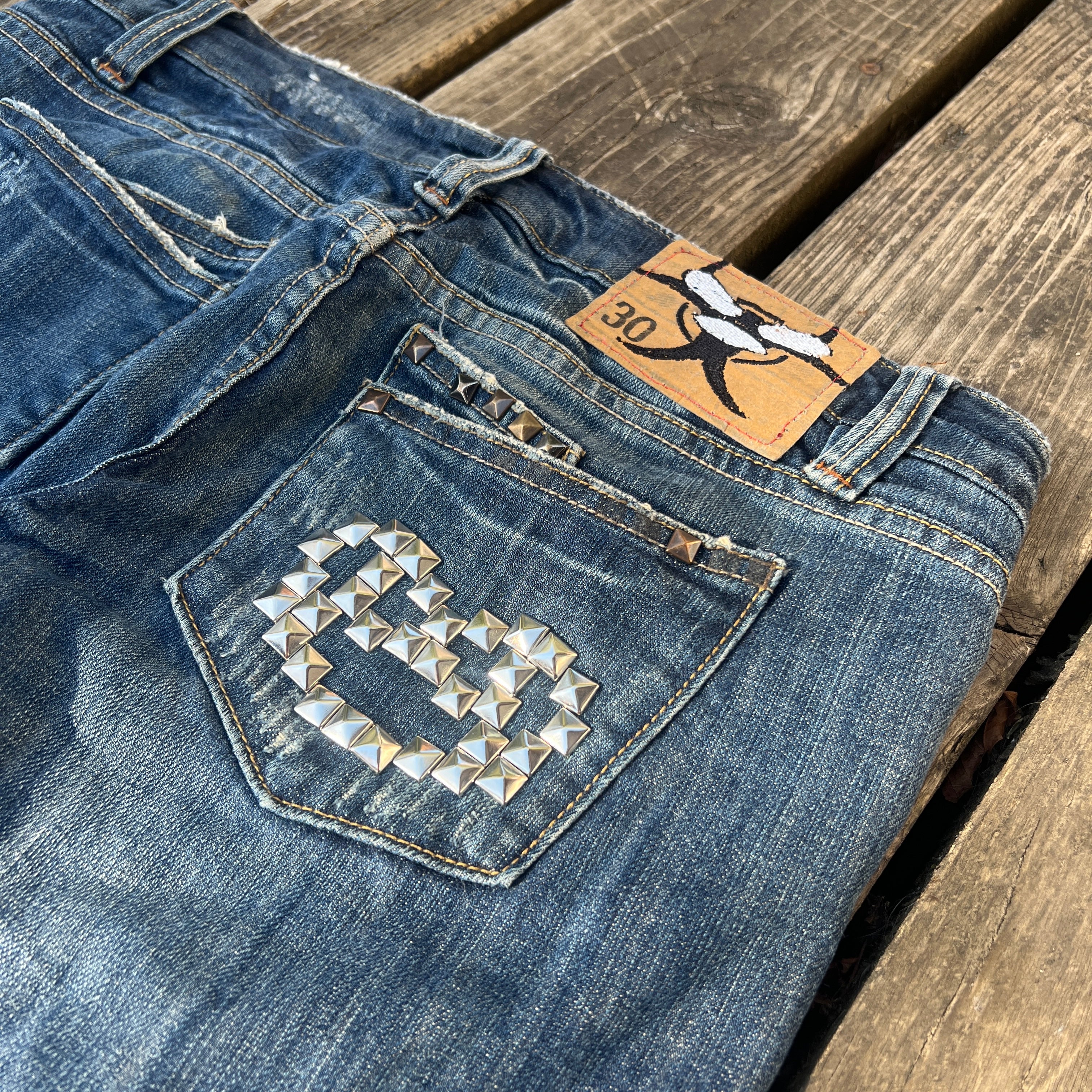 biohazard leopard/brass knuckle jeans