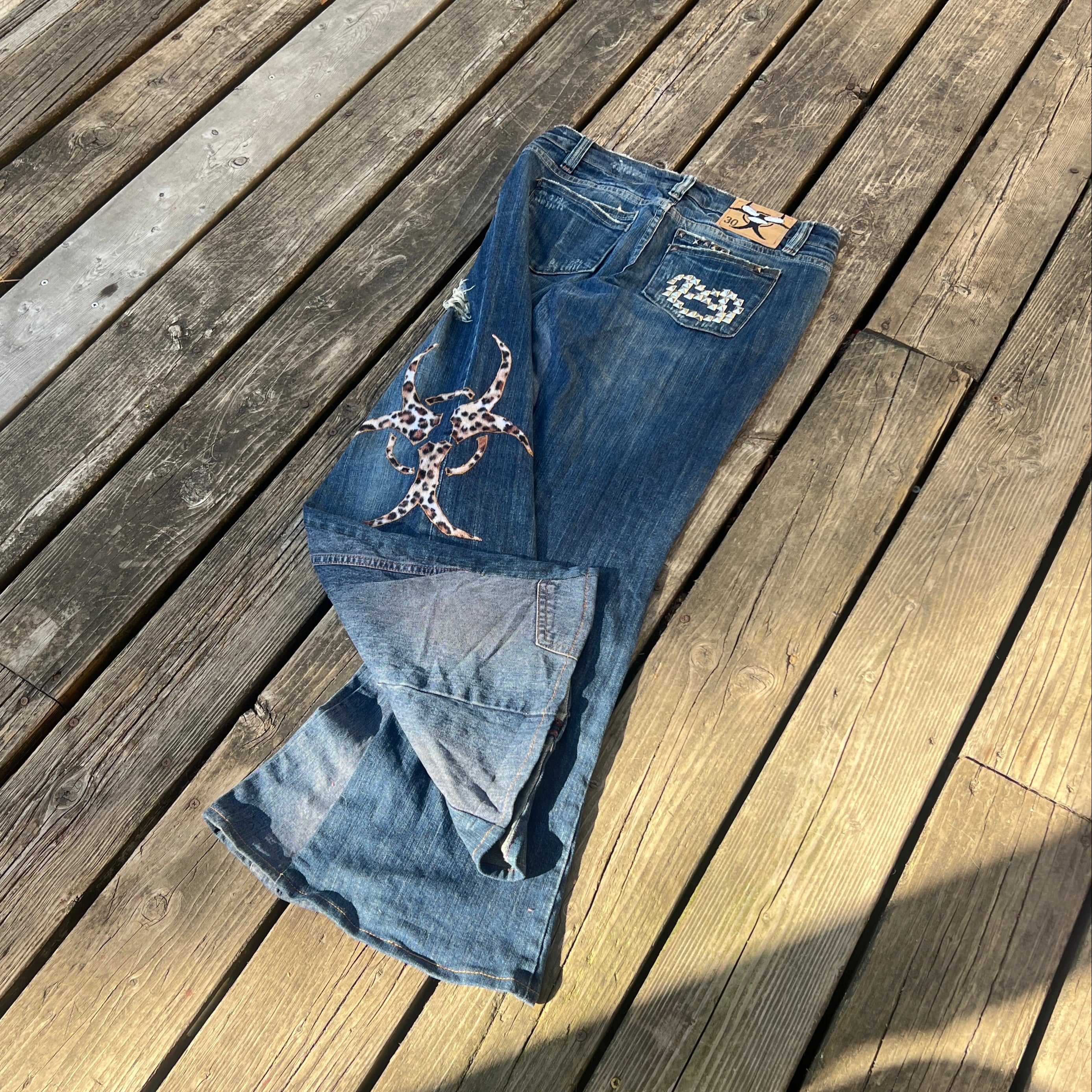 biohazard leopard/brass knuckle jeans