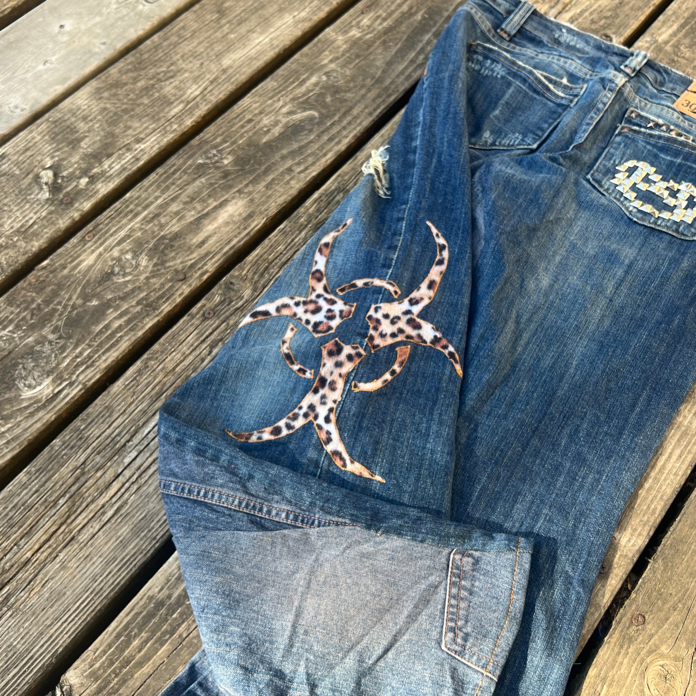 biohazard leopard/brass knuckle jeans